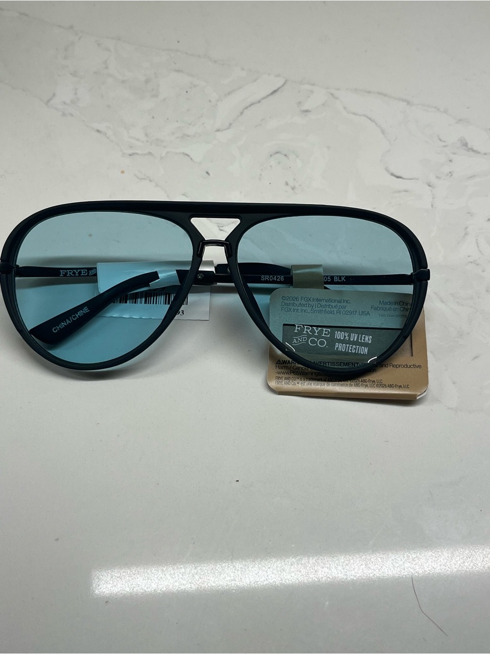 FRYE AND CO. Black Frame Sunglasses with Light Blue Lenses